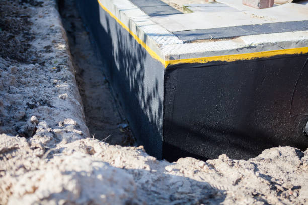 Professional Interior Drainage System technician working in Riley, KS